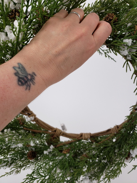 Hold up the wreath as you want to hang it and see how it shapes up