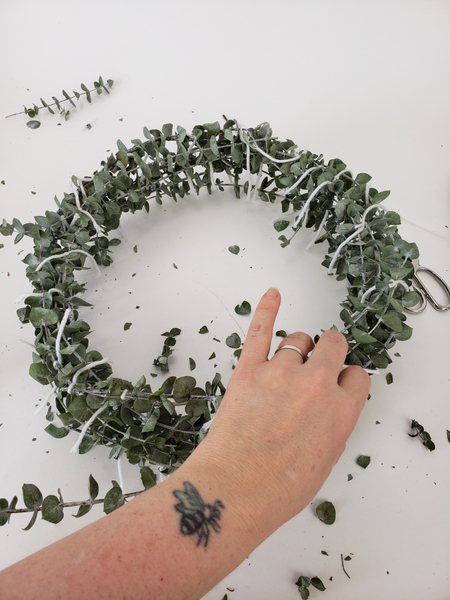 Bulk out the shape by filling any gaps on the outside of the wreath shape