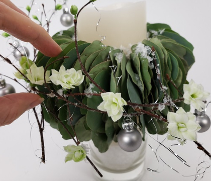 Eucalyptus collar for a snow-covered Christmas candle