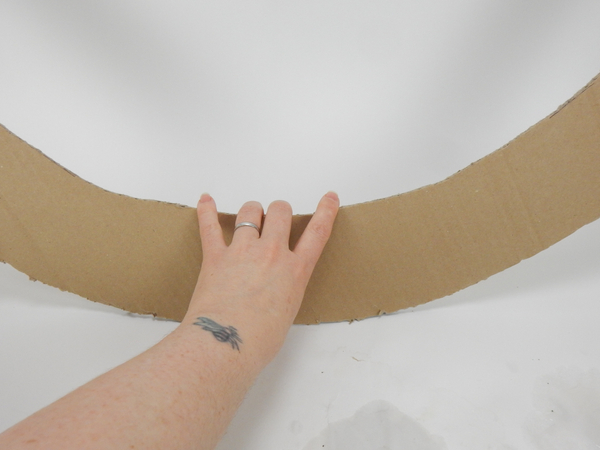 Cut out a huge sturdy cardboard doughnut shape