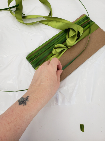 Add a band of grass below the ribbon to start to cover the lower half.