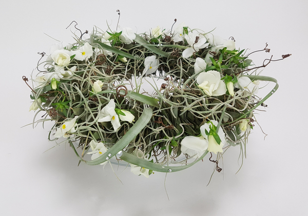 Craft an eucalyptus lei to create a table top wreath