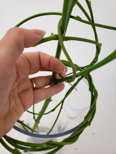 Go around the wreath and bend and twirl all the weaving stems