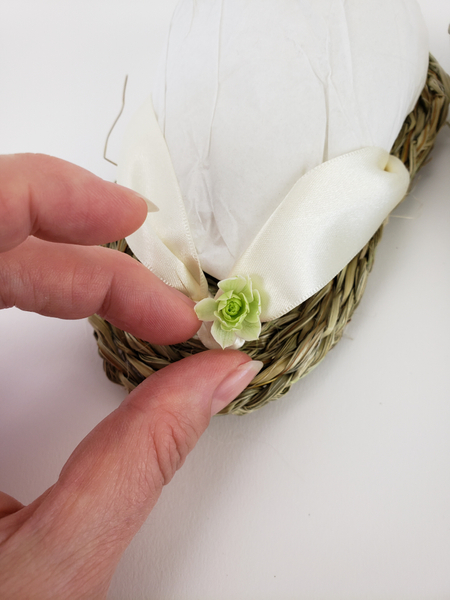 Cut away the stem and glue the flower to the ribbon with floral glue