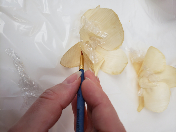 Paint the underside of the petals with the glue mixture
