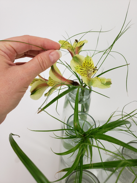 Slip an Inca lily stem through the papyrus.