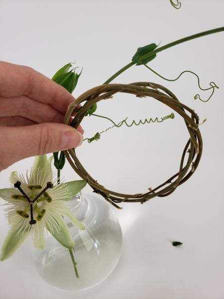 Thread the vine through the first wreath