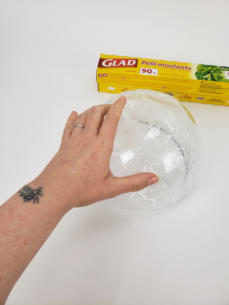 Cover a bowl with cling wrap