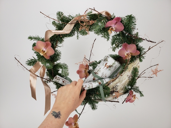 Craft a wreath with a special place to put small gifts for contact free gift pick up or delivery