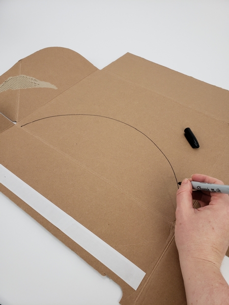 Draw out two half moon shapes on to cardboard