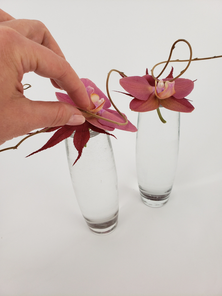 Rest a dried vine over the two vases