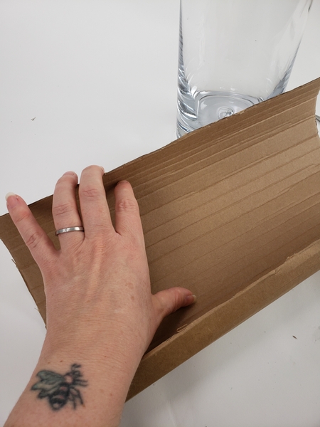 You will see horizontal folds in the cardboard