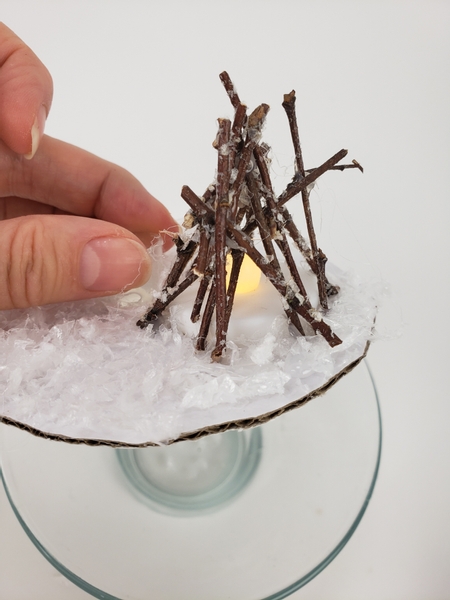 Add tiny bits of snow so that it blends in with the rest of the snow globe look of the design