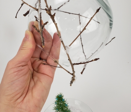 Cardboard base for a roasting-by-an-open-fire fishbowl vase snow globe