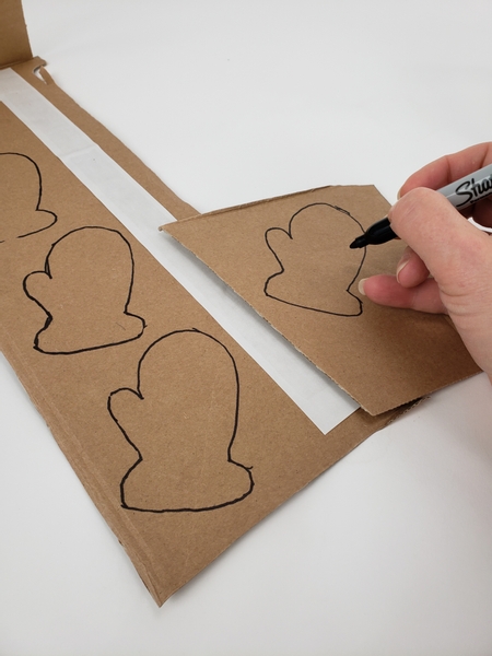 Draw the mitten outline on cardboard