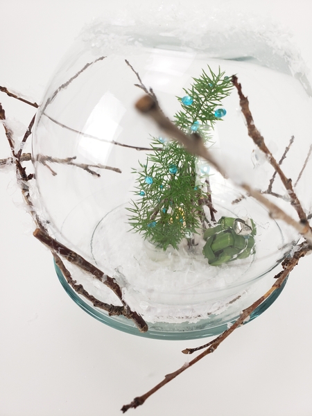 Fresh floral details in a winter Christmas design snow globe