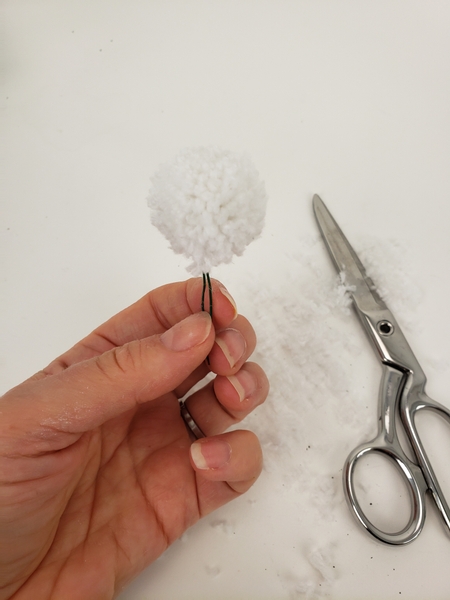 Give the pom pom a trim to make sure it is the shape you want