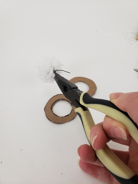 Remove the cardboard and give the wire one more twist