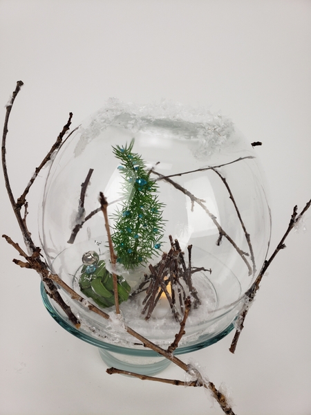 Snow globe with a hidden water source for fresh floral details