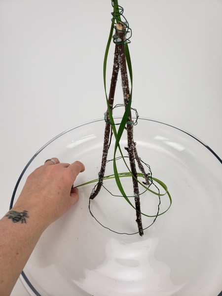 Start to interweave the grass around the armature