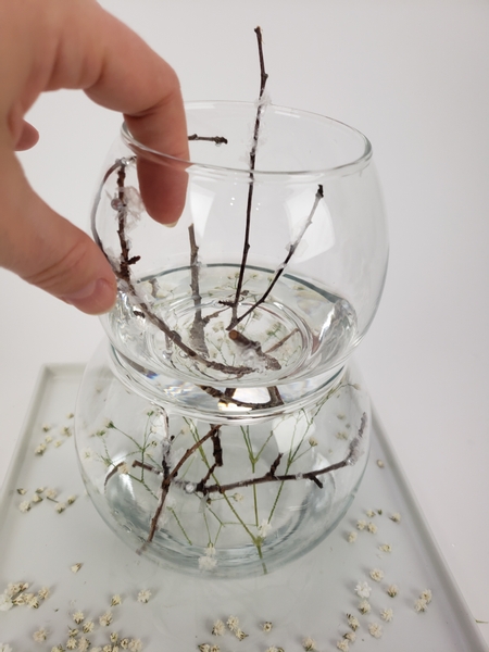 Wedge the snow covered twigs into the bowl