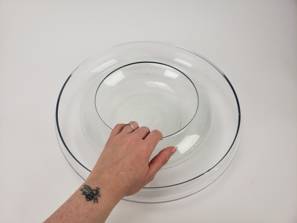 Place a smaller container inside the larger container Place a smaller container inside the larger container