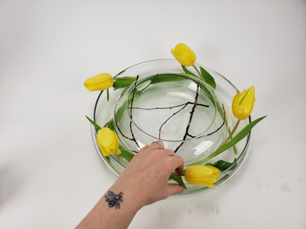 Spacing out the flowers to create a in a vase wreath