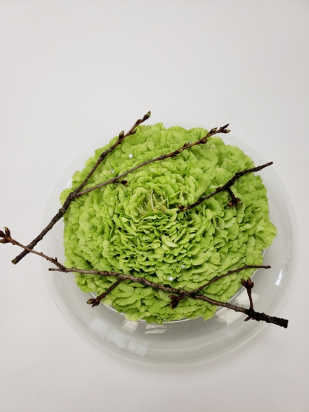 Display freshly pruned blossom twigs in a Spring floral design