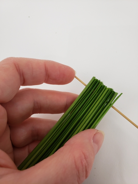 Simply move the grass to the reed end as you add new blades