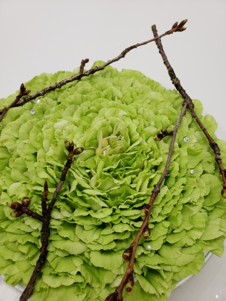 Using the tiny twigs you prune away from blossom trees in a flower arrangement