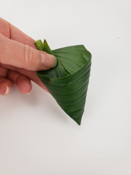 Roll a green leaf into a cone shape