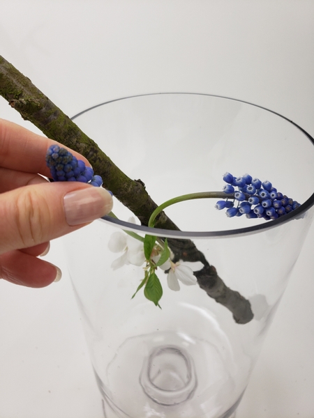 Add the fresh flowers to the design Add the fresh flowers to the design