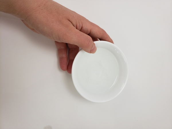 Place a small bowl container on your working surface