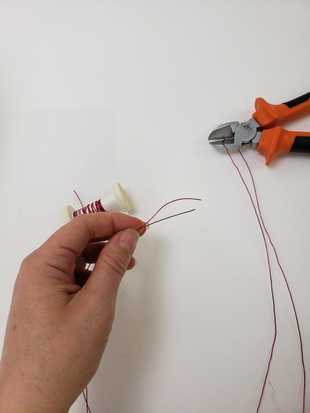 Cut decorative wire to shape the armature