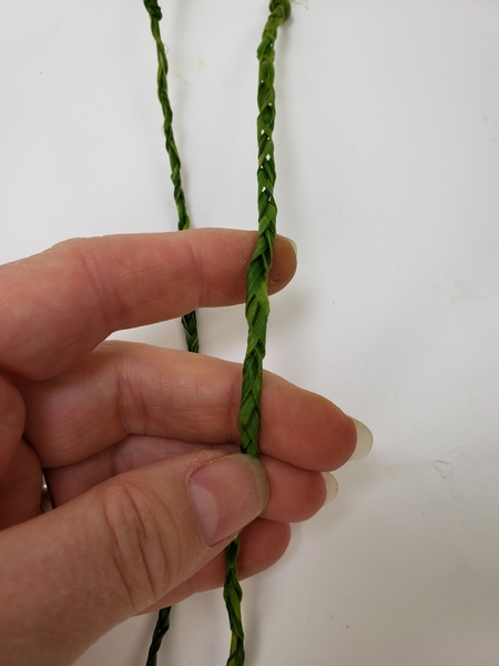 Plait or braid two a strands as ropes to hang the hammock