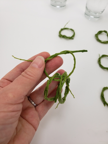 Thread two wreaths on a weaving stem to link them
