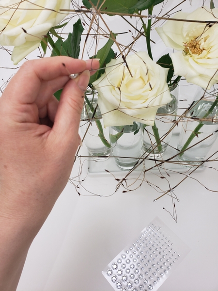 Add in loads of crystal beads all around the design Add in loads of crystal beads all around the design