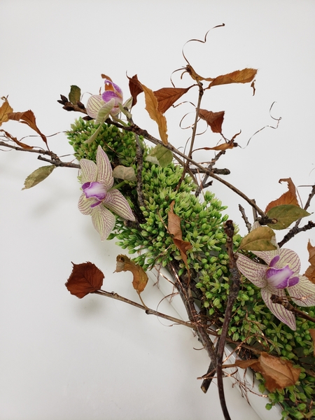Using the foraged autumn leaves you pick up in a floral design