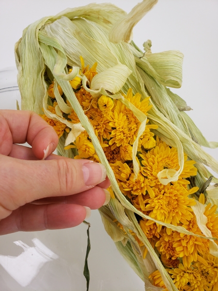 Add in the final layer of the prettiest husks to shadow the flowers and complete the ear of corn