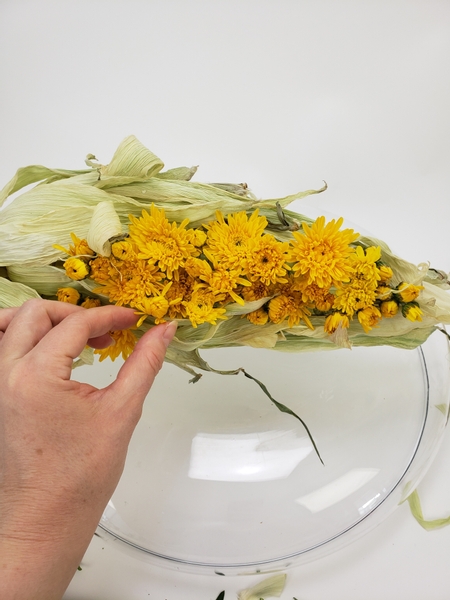 Fill the tubes with water and add in the fresh flowers