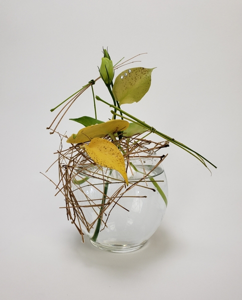 Using the first few Fall leaves in a flower arrangement