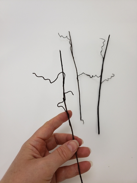 Combine a few tendrils on to a longer taped wire to create a tendril vine