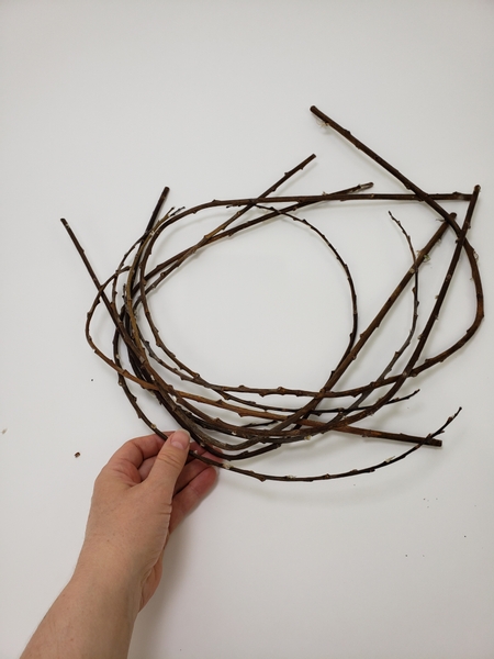 Cut a few curved dry twigs from an old wreath