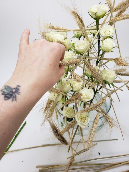 Turn the design and add wheat all around to create a golden ghost ship shape around the roses