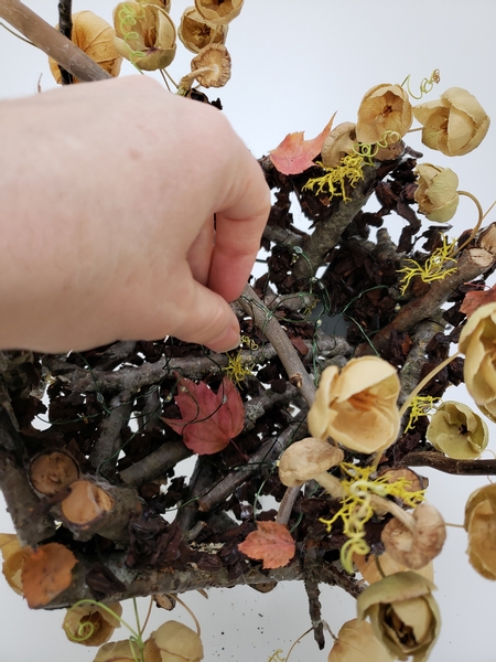 Allowing the bulk of the lights to twirl like a tiny gust of wind on the inside of the forest floor bowl