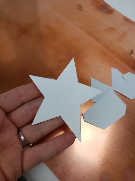 Cut a basic star shape out of paper