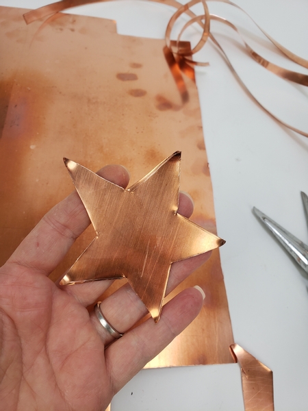 Cut the stars out with heavy duty scissors