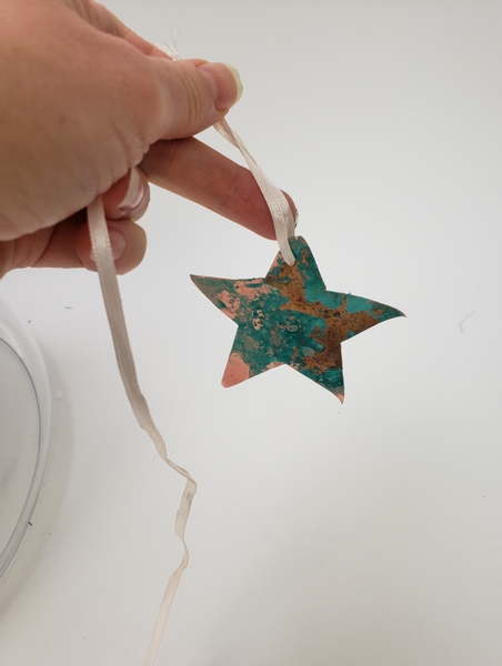 Hang the star by threading a ribbon through the hole