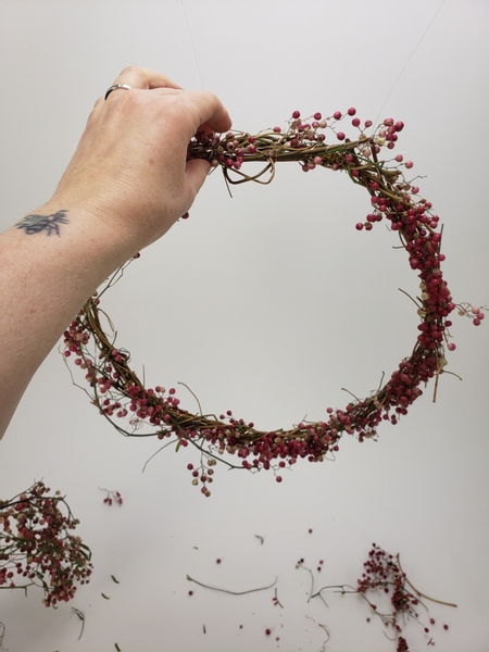 Hang the wreath to design your lush and heavy branches