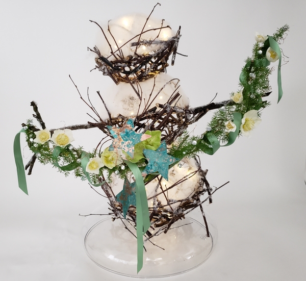 Nature craft twig snowman with Christmas lights